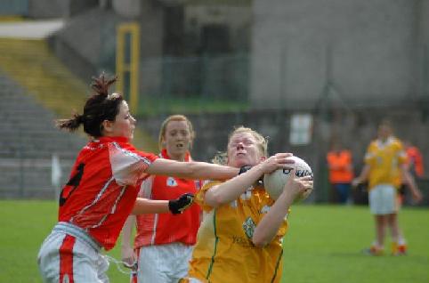 Mairead Cooper holds off an Armagh attack